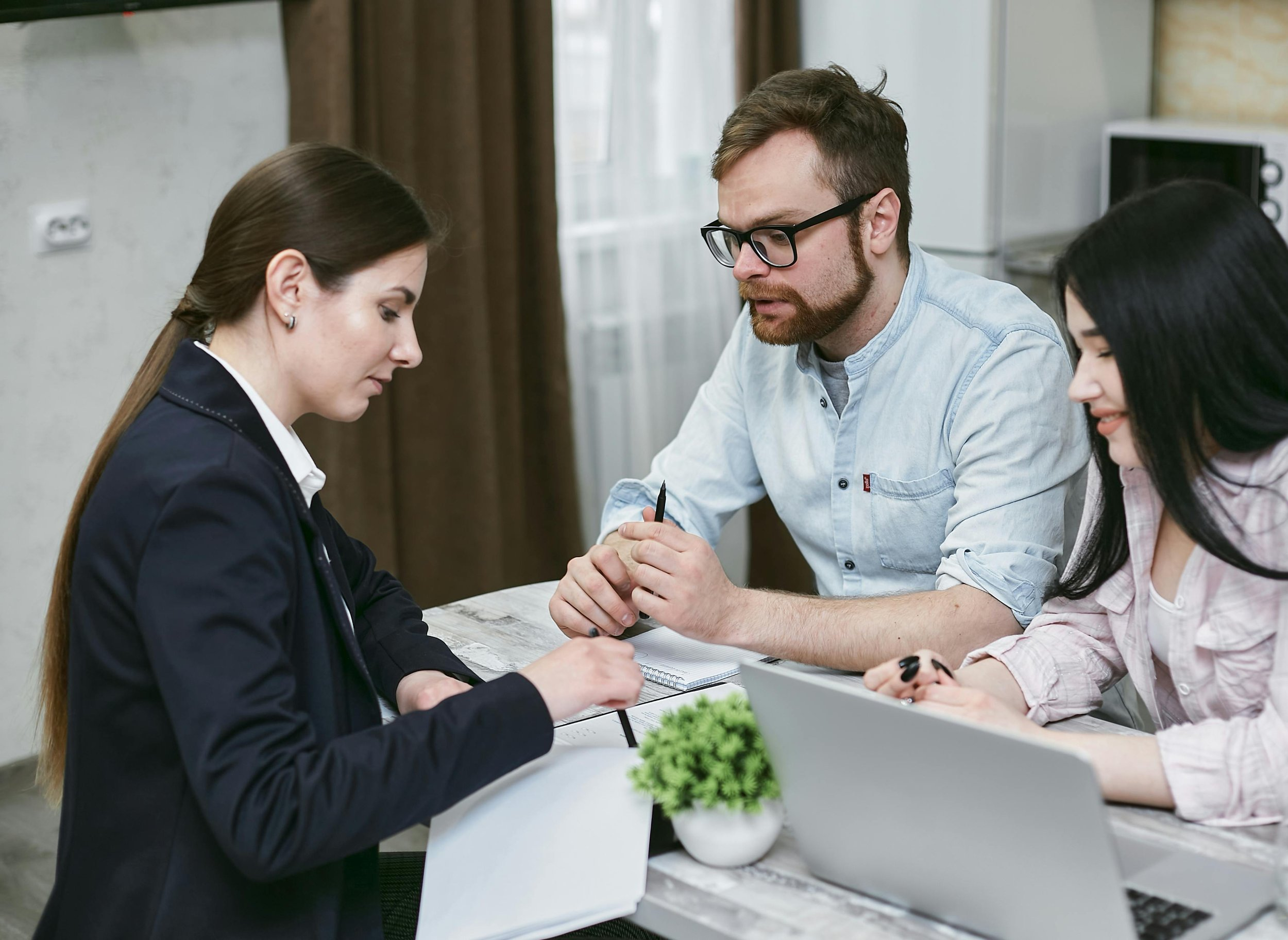 Professionals in a business meeting discussing finances.
